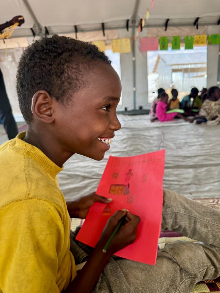 a picture of a child happily participating in cfs activities at renk tc2 upper nile state on 10 may 2024